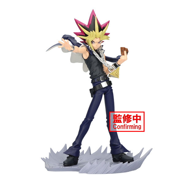 A detailed anime-style figurine, part of the "Yu-Gi-Oh! Senkozekkei - Yami Yugi" collection by Bandai, featuring a character with spiky hair in dark pants and a sleeveless top, posed dynamically on a jagged base. A red box with "Confirming" text is featured at the lower part of the image.