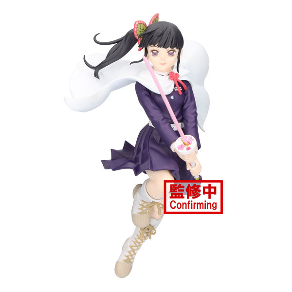 This is a figurine from Bandai's Demon Slayer: Kimetsu no Yaiba Vibration Stars series, featuring Kanao Tsuyuri. The figurine depicts a girl with long black hair styled in a ponytail, dressed in a purple outfit and white boots. She is holding a sword, with a white cape flowing behind her. At the base of the figure is a red sign with Japanese text and the word "Confirming.